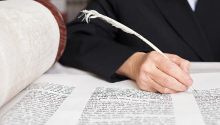 Scribe writing a Torah