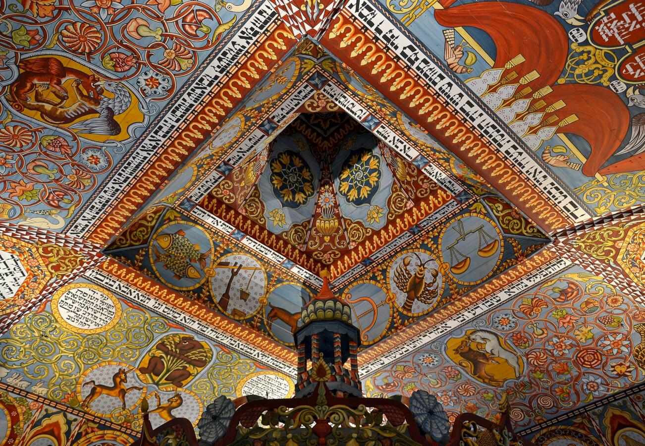 Ornately painted synagogue ceiling.