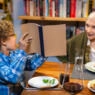 Little Boy Pointing to the Haggadah at Passover Seder