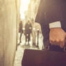 Business person walking with briefcase