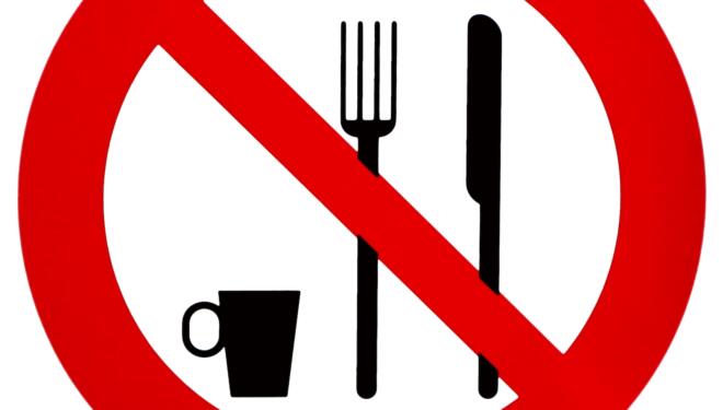 No eating or drinking, prohibition sign, with the silhouette of fork, knife and coffee cup