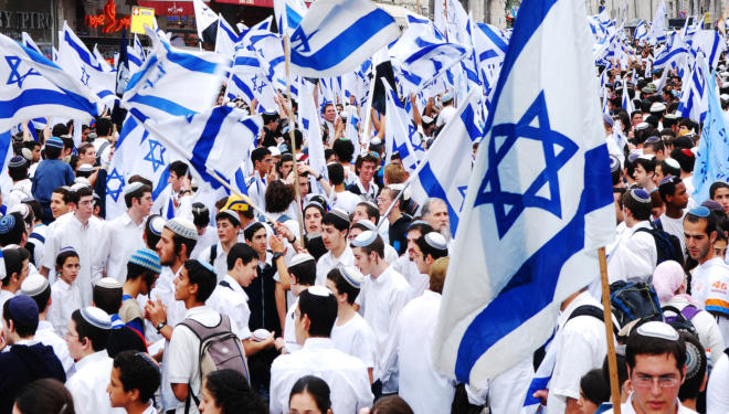 Jerusalem, Israel- April 14, 2007: Young people gathering with flags of Israel at Jaffa Street in the center of Jerusalem to celebrate Israel's Independence Day.