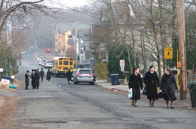 Traditionally dressed Hasidic men and women in New Square, a Hasidic enclave in New York State in 2015. (Uriel Heilman)