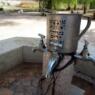 image of an outdoor hand-washing station that has the blessing for washing hands in hebrew