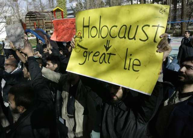 Demonstrators at a rally claiming the Holocaust never occurred. (United States Holocaust Memorial Museum)