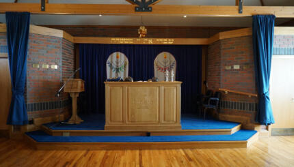 Image of a synagogue bimah with Torah reading table.