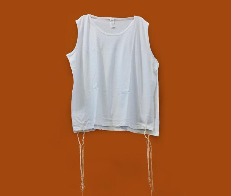 Image of an undershirt with fringes hanging down.