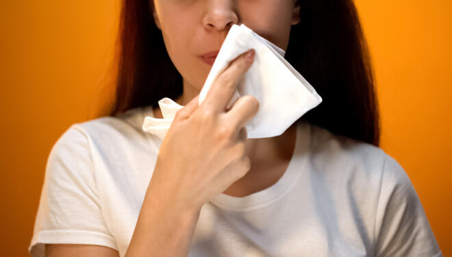 Girl wiping face with napkin after eating, hygiene and etiquette, happy client