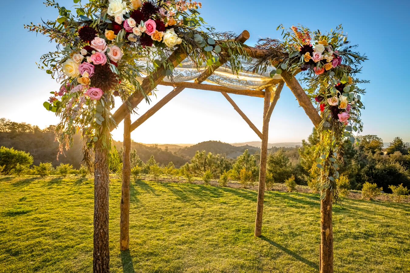 photo of a Jewish wedding canopy outdoors at sunset