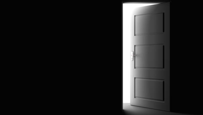 Open door in a dark room