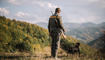 Hunter with hunting dog during a hunt