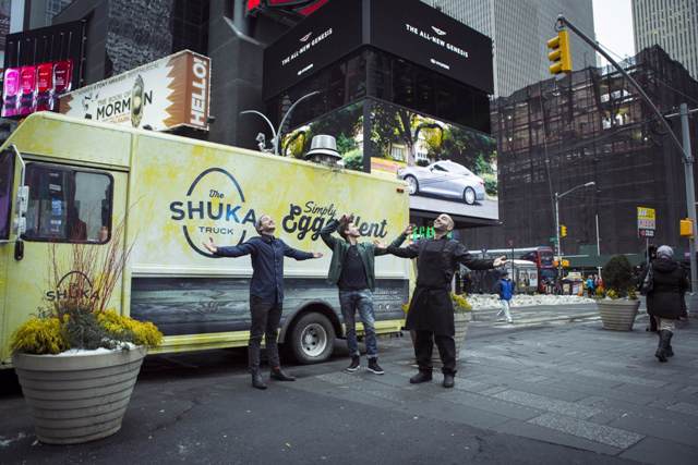 guys in front of shuka truck