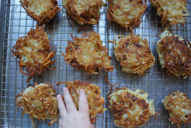 hand with latkes