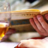 At a Passover seder, a participant reads from a Haggadah, the book used during the seder to retell the story of Exodus.