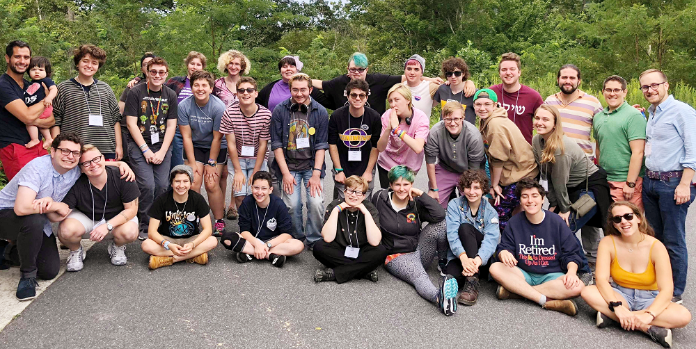 A group of participants and staff from Keshet's LGBTQ and Ally Teen Summertime Shabbaton are gathered outside