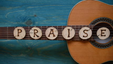 guitar with word praise