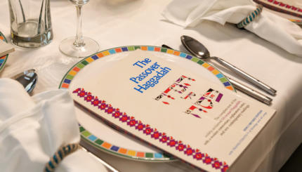 Traditional Passover Seder Table with Haggadah
