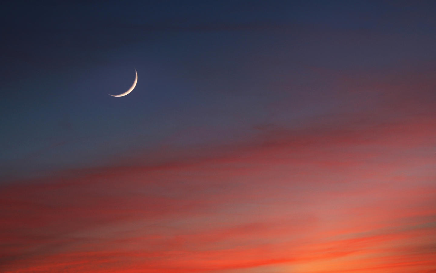 Crescent Moon in Glowing Sunset Skies