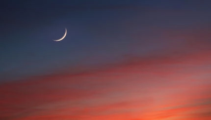 Crescent Moon in Glowing Sunset Skies