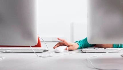 Girl using computer at desk