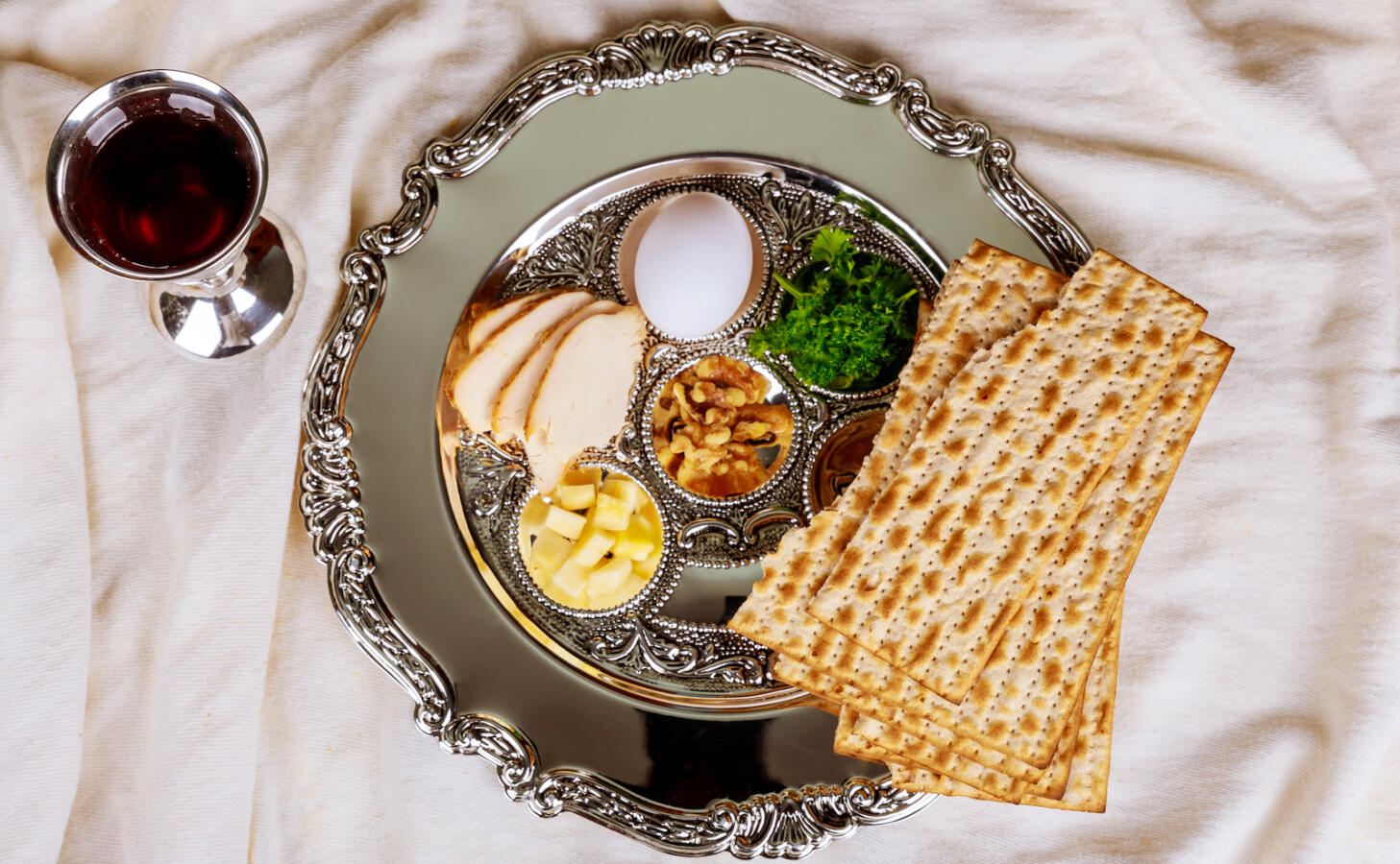Pesah celebration concept jewish Passover holiday . Traditional pesah plate text in hebrew: Passover, egg,