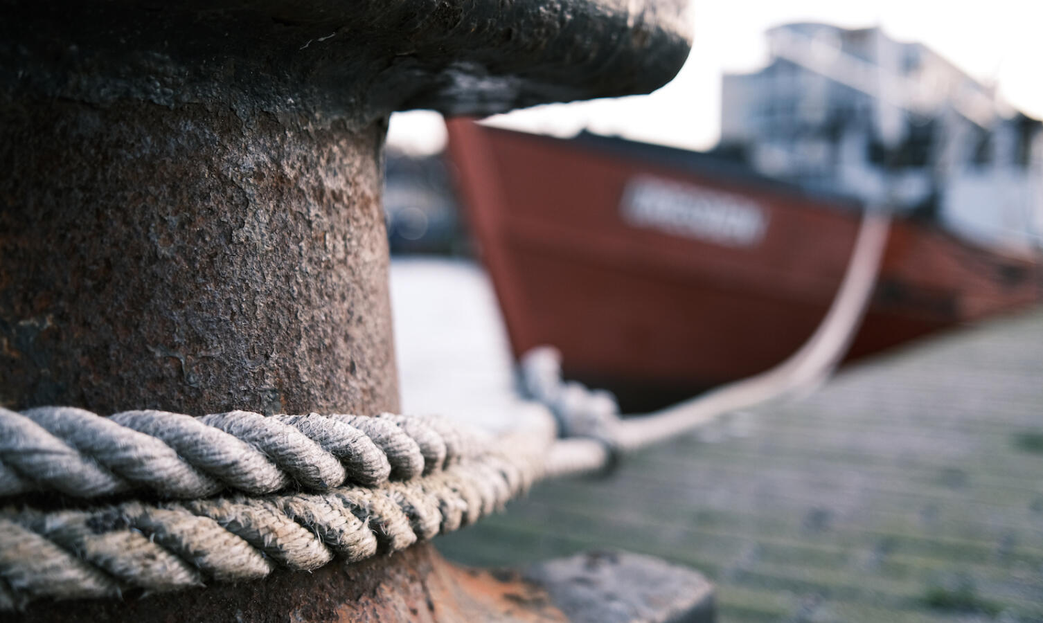 Close-Up Of Rope Tied To Wooden Post