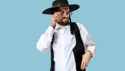 A Hasidic Jew squinting angrily over his glasses.