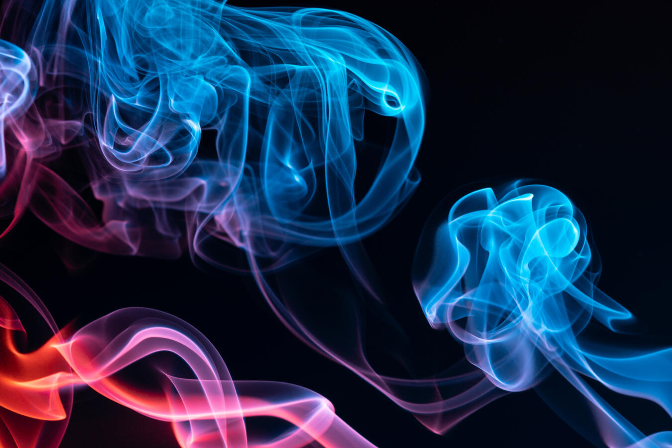 Colorful steam on a black background.