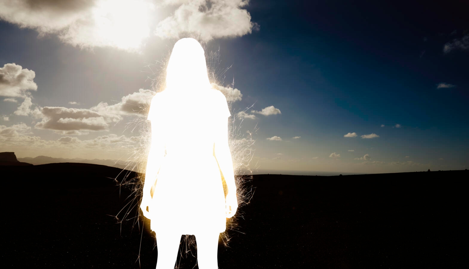 silhouette of electric woman in nature