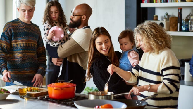 photo of a multi-generational family cooking dinner