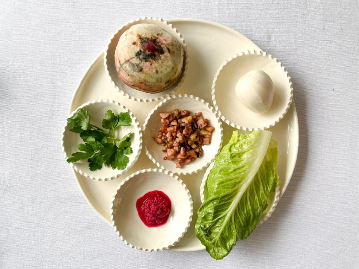 A vegan seder plate for Passover, including an alternative vegetarian shankbone