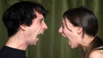 Couple yelling face to face
