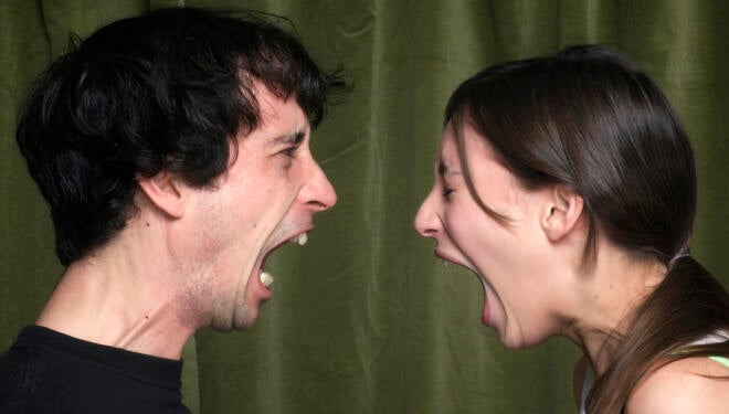 Couple yelling face to face