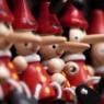 Photo of a row of Pinocchio dolls with long noses.