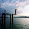 Woman on Diving Board in Lake