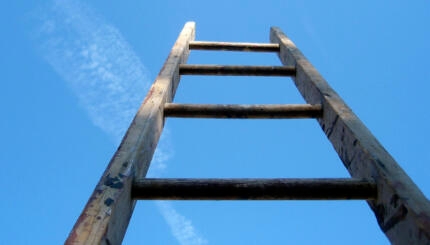 photo of a ladder pointing into the sky