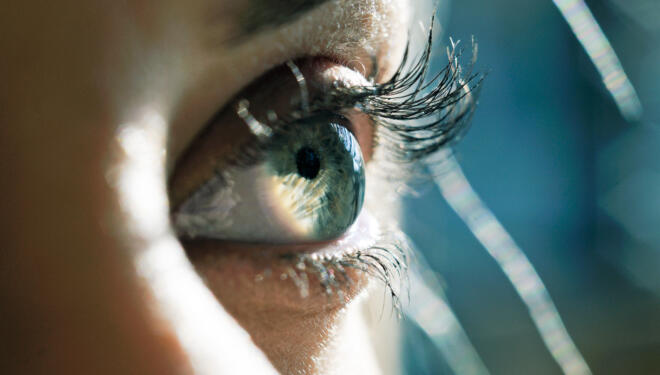 Close up of woman eye with long eyelashes.