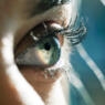 Close up of woman eye with long eyelashes.