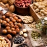 Assortment of nuts on rustic wood table.