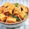 Close-Up Of Tofu With Sauce In Plate