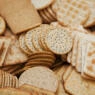 Close up of a large selection of cream crackers.