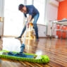 Adult Woman Cleaning Floor in Her Apartment.
