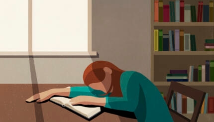 Tired college student sleeping on book at sunny table in library