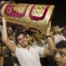 A Jewish man holds a Torah scroll during the Simhat Torah celebration in the Mediterranean coastal city of Netanya, north of Tel Aviv, on September 26, 2013. Simhat Torah is a joyous Jewish celebration that marks the end of the annual cycle of the reading of the entire Torah and the beginning of the new cycle. AFP PHOTO / JACK GUEZ (Photo credit should read JACK GUEZ/AFP via Getty Images)