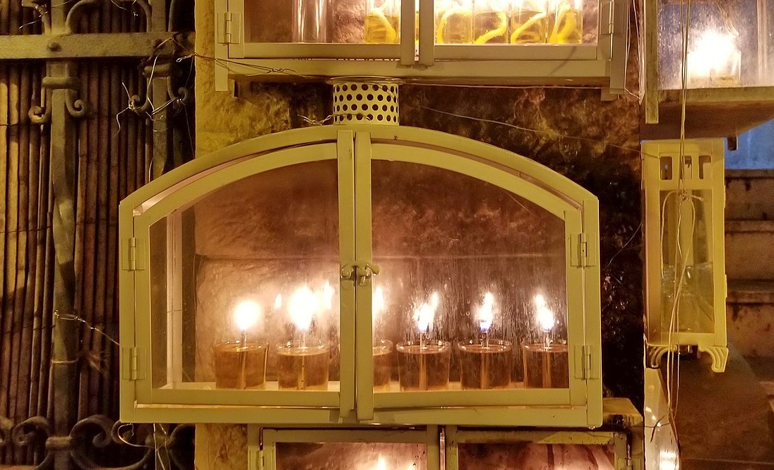 nighttime photo of a box containing candles