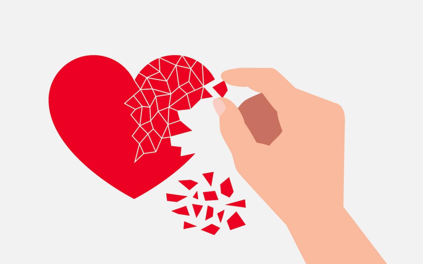 Heart symbol broken into small pieces and hand of person assembling it
