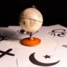image of a globe surrounding by symbols of different faith traditions